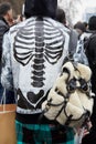 Man with skeleton design on black leather jacket and sheepskin backpack before Etro fashion show