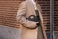Milan, Italy - January, 13, 2024: man wears Fendi Peekaboo ISeeU XCross bag, street style details, fashion outfit Royalty Free Stock Photo