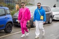 Men with pink sweatsuit and blue hoodie before Etro fashion show, Milan Fashion Week street style