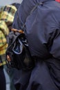 Woman with black leather backpack with bamboo handle before John Richmond fashion show, Milan