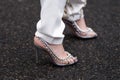 Milan, Italy - January, 25, 2024: woman wears Aquazzura high heel crystal sandals, street style Royalty Free Stock Photo