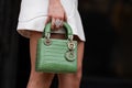 Milan, Italy - January, 24, 2024: woman wears Dior Lady bag, street style details, fashion detail.