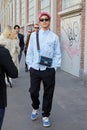 Yamato with blue shirt and bag before Fendi fashion show, Milan Fashion Week street style