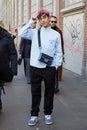 Yamato with blue shirt and bag before Fendi fashion show, Milan Fashion Week street style