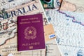 Milan, Italy Ã¢â¬â July 20, 2018 : An Italian passport with a smartphone over a tourist magazine of South America, on a light