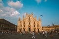 Milan, Italy July 13, 2013:Piazza Duomo, a multitude of people animate the square in front of the main symbol of the city, the Duo