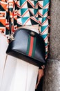 Milan, Italy - June 25, 2022: fashioner wearing Gucci Ophidia shoulder bag. Fashion blogger outfit details