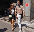 MILAN, ITALY -JUNE 16, 2018: Fashionable couple walking in the street before MARNI fashion show, during Milan Fashion Week Royalty Free Stock Photo
