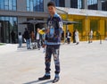 MILAN, ITALY -JUNE 18, 2018: Fashionable man posing for photographer in the street after NEIL BARRET fashion show Royalty Free Stock Photo