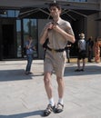 MILAN, ITALY -JUNE 18, 2018: Fashionable man posing for photographer in the street after NEIL BARRET fashion show Royalty Free Stock Photo