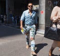 MILAN, ITALY -JUNE 16, 2018: Fashionable man walking in the street before MARNI fashion show, during Milan Fashion Week Royalty Free Stock Photo