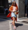 MILAN, ITALY -JUNE 16, 2018: Fashionable woman walking in the street before MARNI fashion show, during Milan Fa Royalty Free Stock Photo