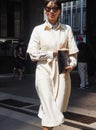 MILAN, ITALY -JUNE 16, 2018: Fashionable woman walking in the street before MARNI fashion show, during Milan Fashion Week Royalty Free Stock Photo