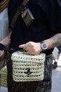 Man with Breitling watch and wicker bag before Fendi fashion show, Milan Fashion Week street style Royalty Free Stock Photo