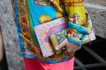 Man with colorful silk shirt and wallet before Versace fashion show, Milan Fashion Week street style