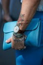 Man with IWC watch and blue leather bag before Fendi fashion show, Milan Fashion Week street style
