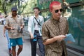 Man with pink hair and Fendi shirt and sunglasses before Emporio Armani fashion show, Milan Fashion