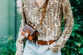 Milan, Italy - June, 19, 2022: man wears medium shoulder bag from the Crown Me collection and paisley printed shirt from