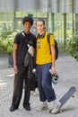 Men with black and yellow shirt and skateboard before Etro fashion show, Milan