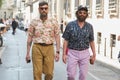 Men with mustard color and pale purple trousers before Giorgio Armani fashion show, Milan