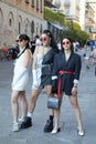 Three women in black and white outfit before Palm Angels fashion show, Milan Fashion Week street