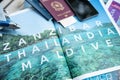 Milan, Italy - June 2023: Travel documents on a tourist magazine ready for the Zanzibar Thailand Maldives tour. Holidays