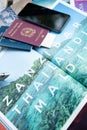 Milan, Italy - June 2023: Travel documents on a tourist magazine ready for the Zanzibar Thailand Maldives tour. Holidays