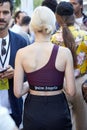 Woman with burgundy Palm Angels shirt before Palm Angels fashion show, Milan Fashion Week street