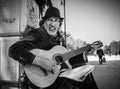 Milan, Italy - March 23, 2016: Aged street guitar singer on the