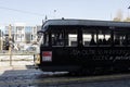 Famous vintage tram in the centre of the Old Town of Milan in the sunny day - Woman driver in