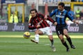 Andrea Pirlo and Luis Figo in action during the match