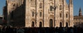 Milan, Italy - March 23, 2019: Panorama of Duomo. People in front of facade of italian gothic church in the centre of Milan, Italy