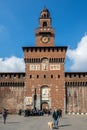 Travelers at front gate of the Sforzesco Castle, Italy