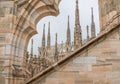 Milan Cathedral close-up, Milan, Italy. Detail of the facade, exterior with many marble statues, reliefs.