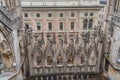 Milan Cathedral close-up, Milan, Italy. Detail of the facade, exterior with many marble statues, reliefs.