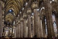 Interior of old Milan Cathedral or Duomo di Milano. It is great Catholic church, top landmark of Milan. Inside the dark Gothic