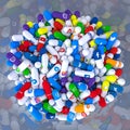 Pills of various types and sizes in a bottle bearing the logo of the most famous social networks