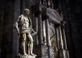 Statue of St Bartholomew Flayed inside the Milan Cathedral Duomo di Milano. Scary statue in gloomy Gothic interior Royalty Free Stock Photo