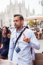 MILAN, ITALY - May, 2019: Tour guide giving explanation about Duomo square in Milan Italy