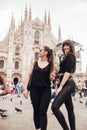 Milan, Italy - May 16, 2018: Two girls strolling towards Duomo Square and Vittorio Emanuele II galleries in Italy, Milan at Royalty Free Stock Photo