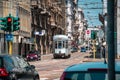 Milan, Italy- 06.07.2019: Milan street panorama old white tram and cars. Vintage tram. European public transport