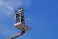 MILAN , ITALY -10 November 2015 : Cameraman working on an aerial work platform