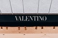 Milan, Italy - November, 13, 2021: Facade logo of fashion women's clothing store Maison Valentino.