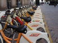 Milan, Italy - November 20, 2019: Mobike dockless bicycles parked in a street.