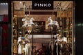 Milan Italy PINKO store exterior with logo and seasonal decoration.