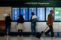 MILAN, ITALY - OCTOBER 9, 2017: Airport, people go to the flight departure boards in background