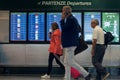 MILAN, ITALY - OCTOBER 9, 2017: Airport, people go to the flight departure boards in background