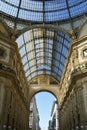 Milan, Italy, October 2021: Galleria Vittorio Emanuele II, an old shopping gallery, upwards view from inside the arcade. Royalty Free Stock Photo