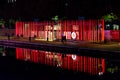 Milan, Italy - October 19th, 2015:High luminous red pillars with Vodafone logo on the waterfront