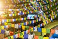 Milan, Italy - October 20th, 2015:Multi-coloured rag tags of a garland are hanged out on cords in one of the Chinese quarters